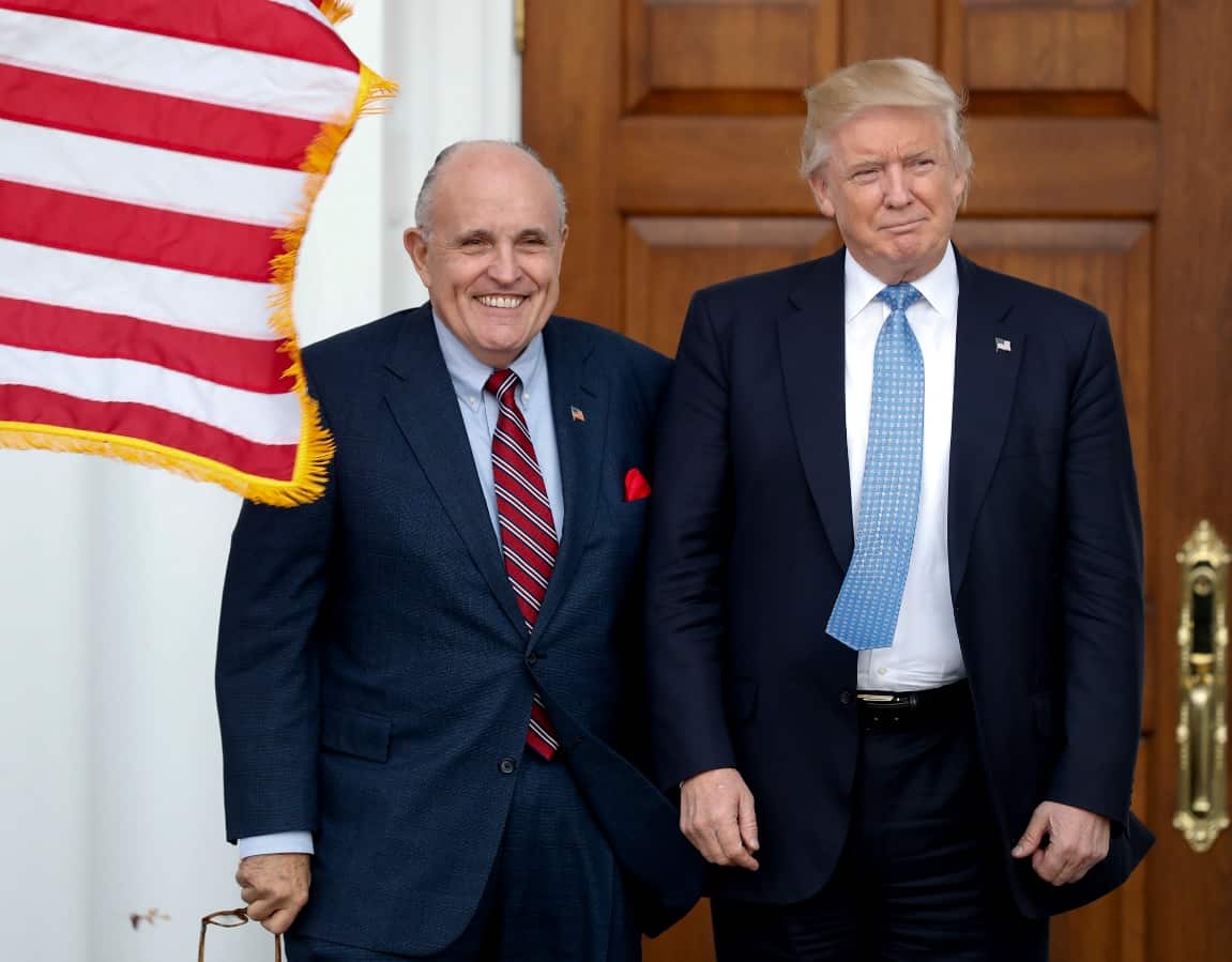 File: President Donald Trump, right, and former New York Mayor Rudy Giuliani pose for photographs as Giuliani