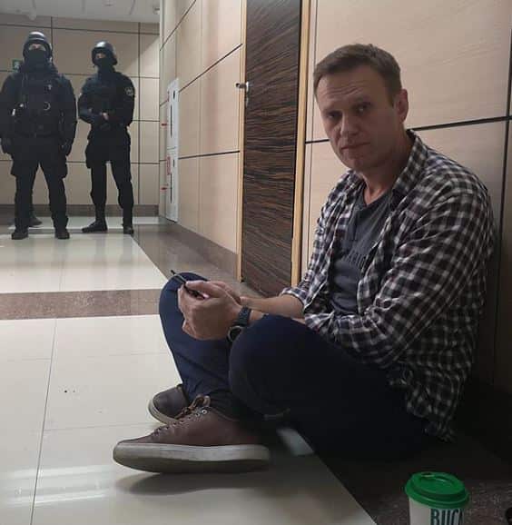 Another shot of the opposition politician during the police raid.