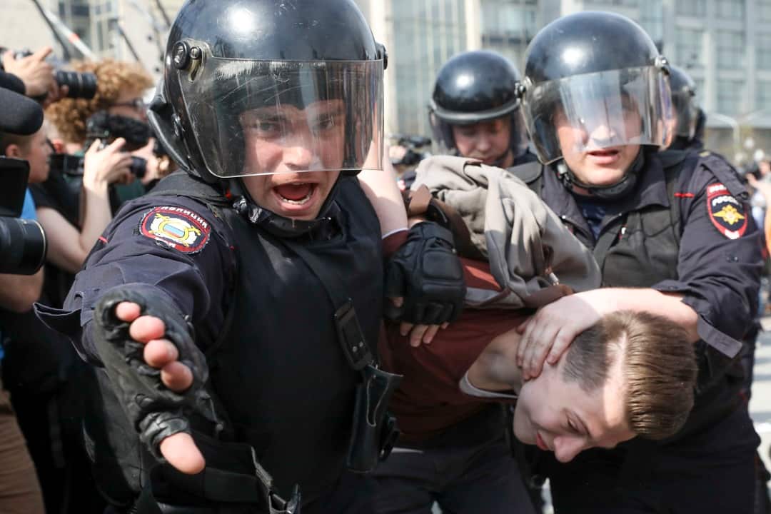 Russian police detain a protester at a demonstration against President Vladimir Putin in Pushkin Square, Moscow.