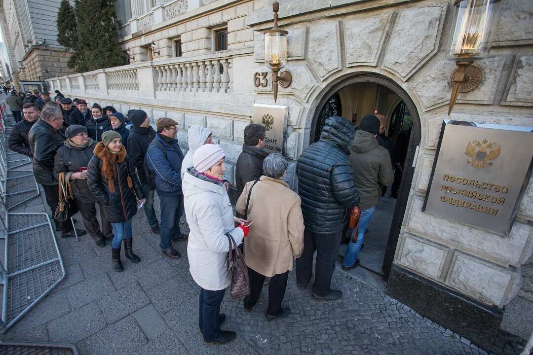 Russians queue to cast their votes at the Russian Embassy in Berlin, Germany.