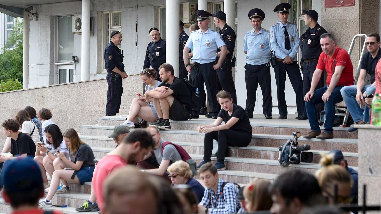 Journalists and supporters of Ivan Golunov, a journalist who worked for the independent website Meduza, gather at a court building in Moscow.