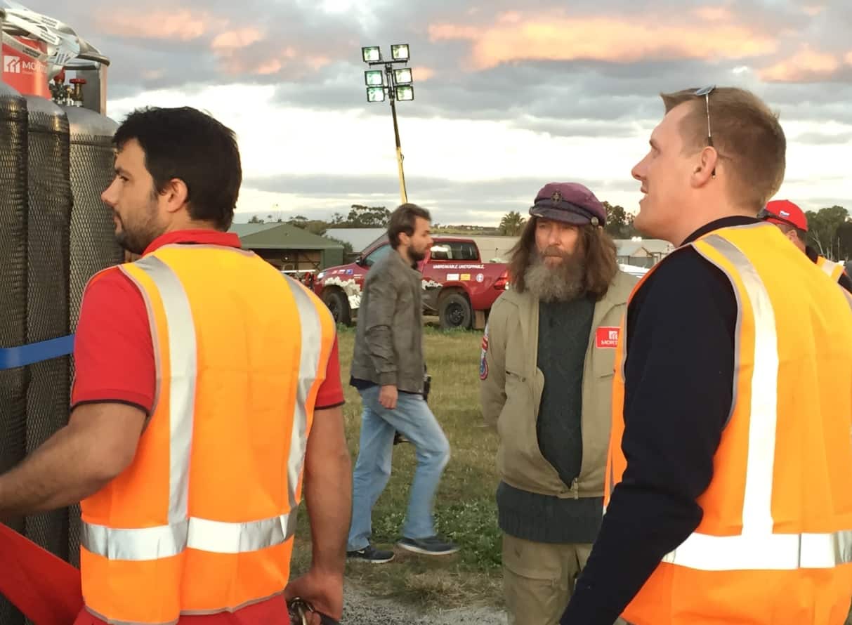 Konyukhov (centre) on Monday evening as his balloon is inspected (SBS)