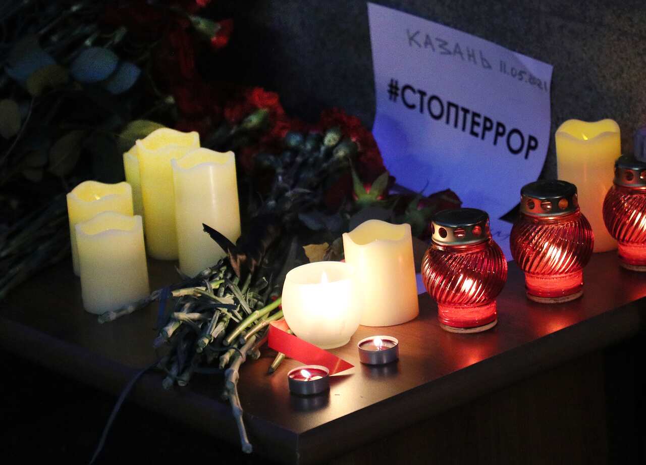 Candles lit by mourners for Kazan school shooting victims outside the Moscow representative office of Russia's Republic of Tatarstan.