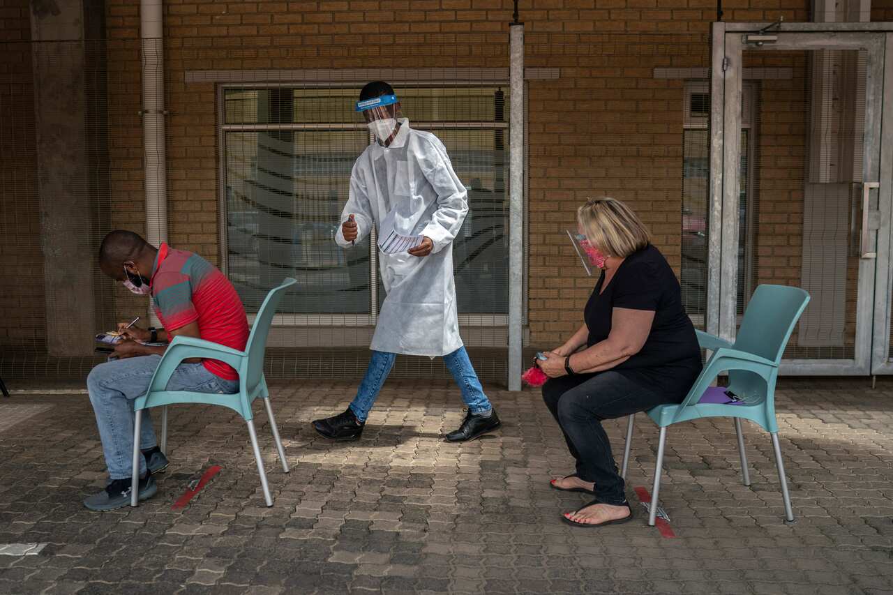Patients fill out forms before taking a COVID test in Johannesburg, South Africa,.5 January, 2021.