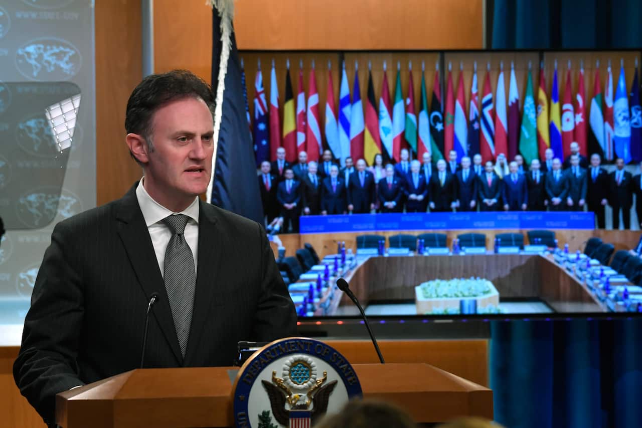 Ambassador Nathan Sales speaks during a news conference at the State Department in Washington.