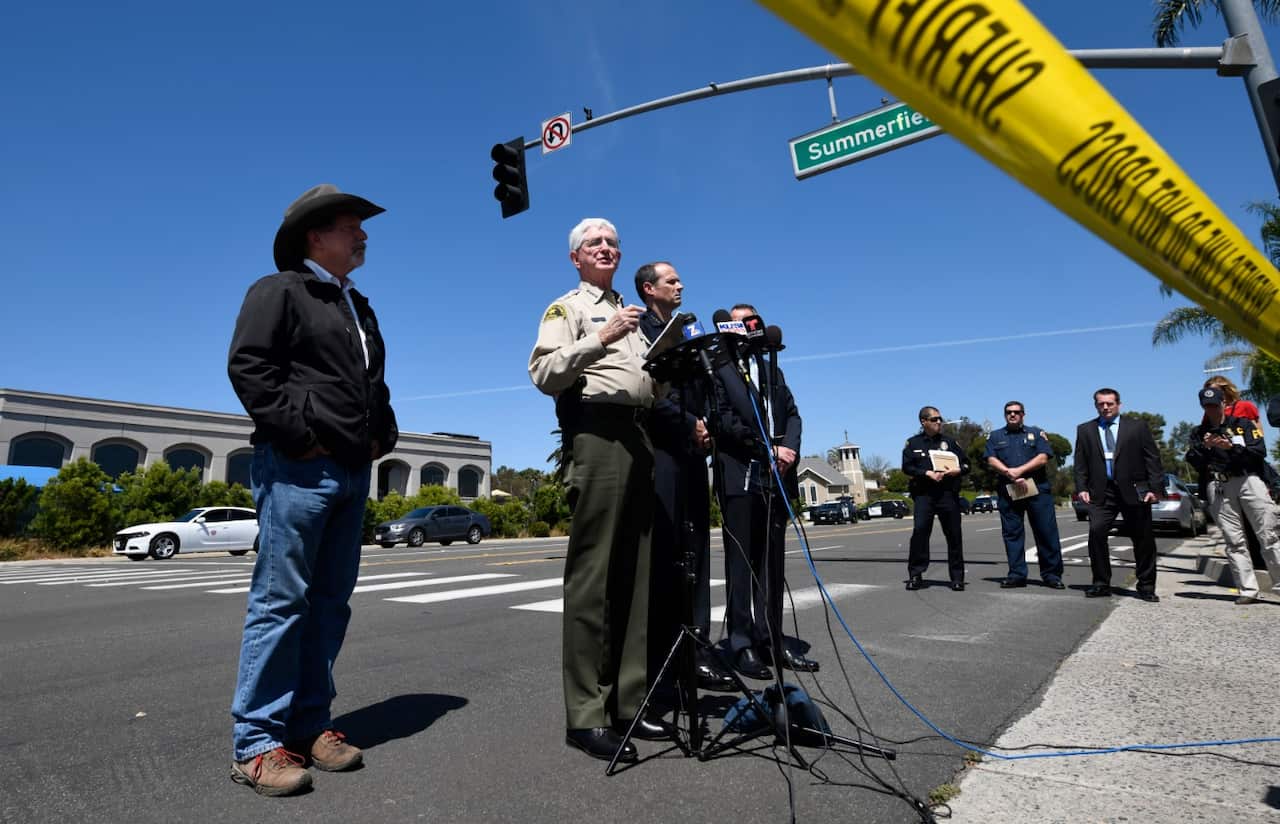 San Diego County Sheriff Bill Gore, center, speaks at a news conference held outside of the Chabad of Poway Synagogue Saturday, April 27, 2019