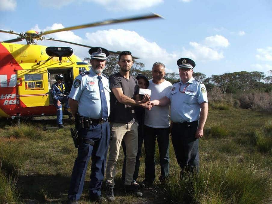 Sasoon and family with some of the search and rescue team.
