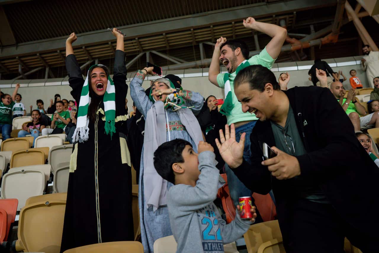 Fans cheer at a soccer match in Jeddah, Saudi Arabia, the first soccer match women were allowed to attend at a public stadium in the country. (Tasneem Alsultan/The New York Times)