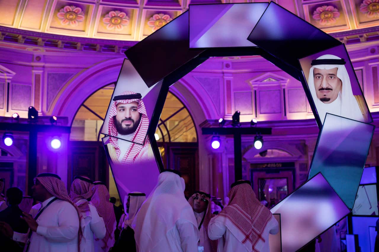 Images of King Salman, right, and his son Crown Prince Mohammed bin Salman projected on screens during a conference at the Ritz-Carlton in Riyadh, Saudi Arabia, Jan. 28, 2019. (Tasneem Alsultan/The New York Times)