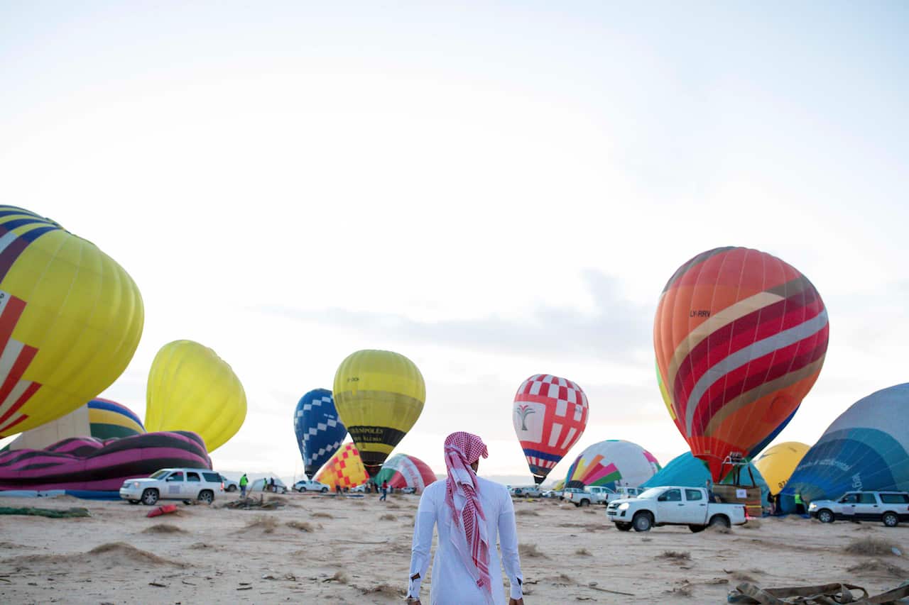Hot air balloons are prepared for tourists in Al-Ula, Saudi Arabia/