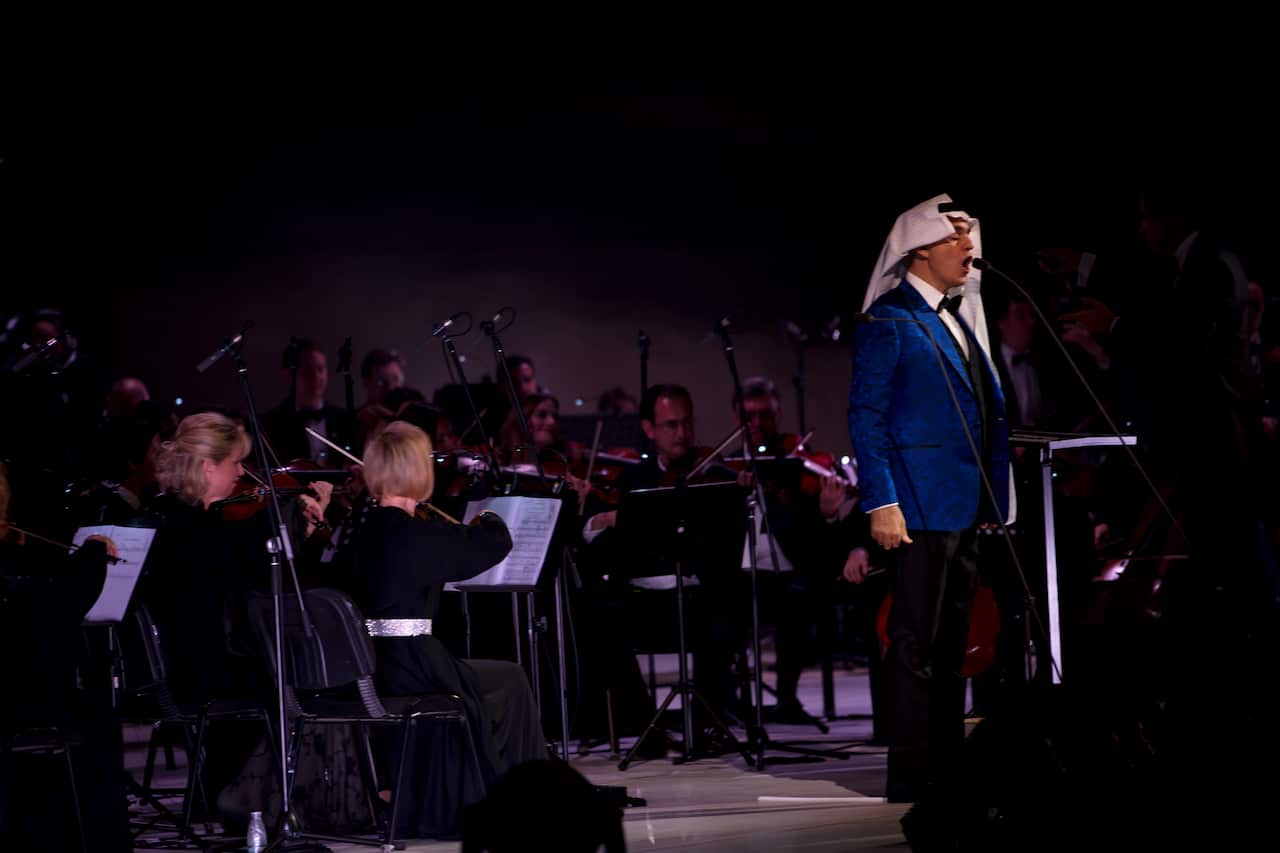 Andrea Bocelli, in Saudi attire, performs at a festival in Al-Ula, Saudi Arabia.