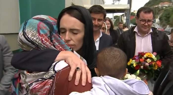 Jacinda Ardern comforting members of New Zealand's muslim community.