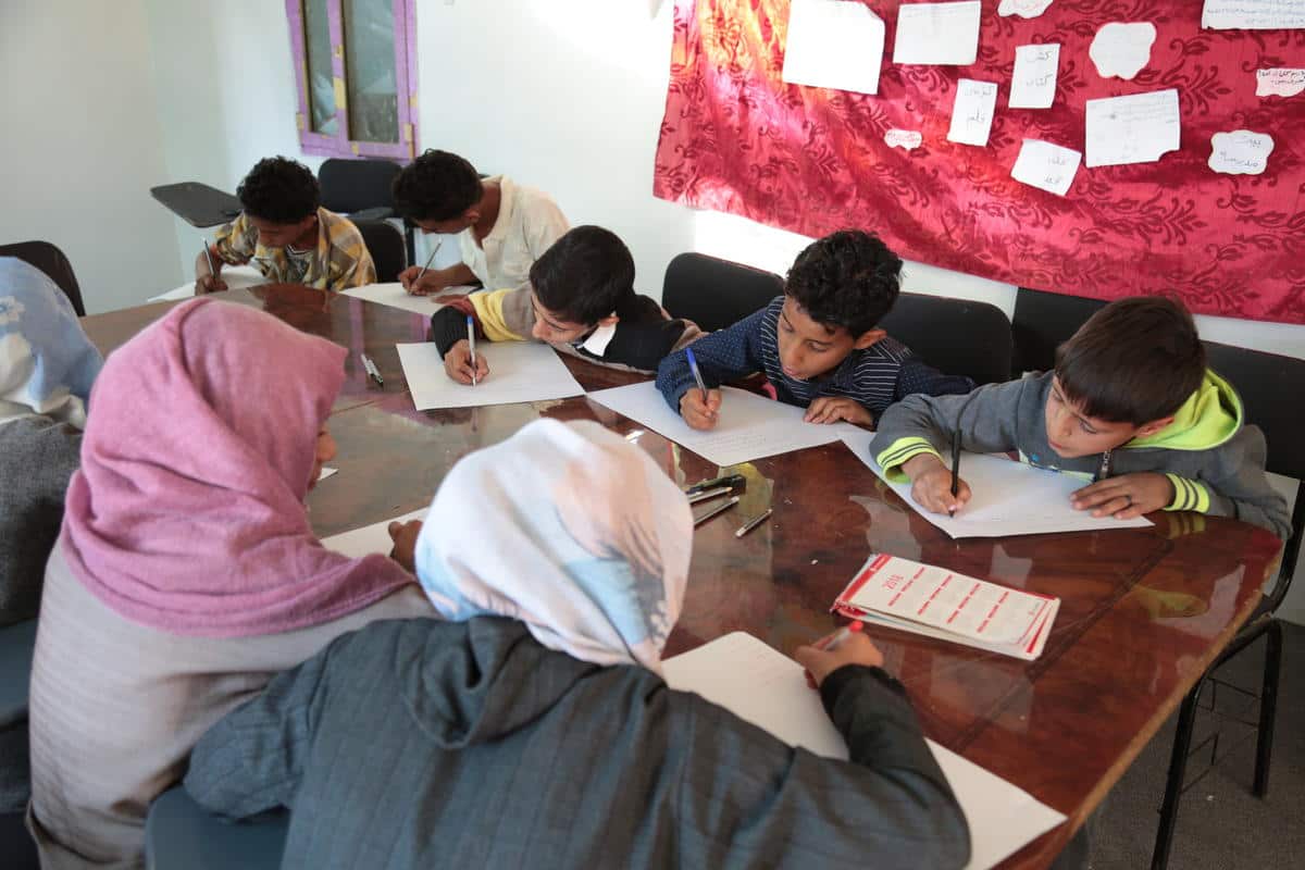 Children at a Child Friendly Space in Sana'a drafting a resolution for the war in Yemen.