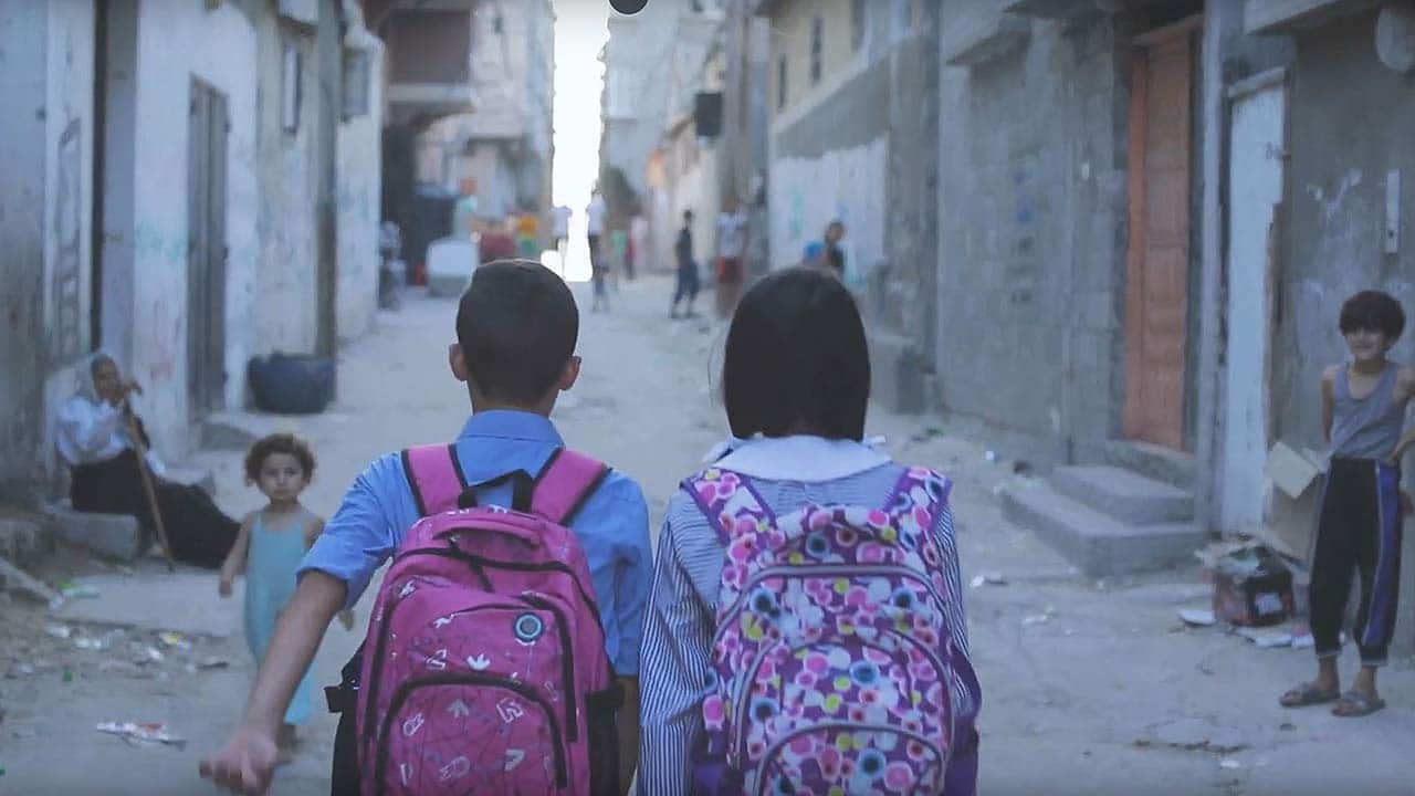 The UN Relief and Works Agency for Palestine Refugees (UNRWA) has helped Palestine refugee children go to  school.