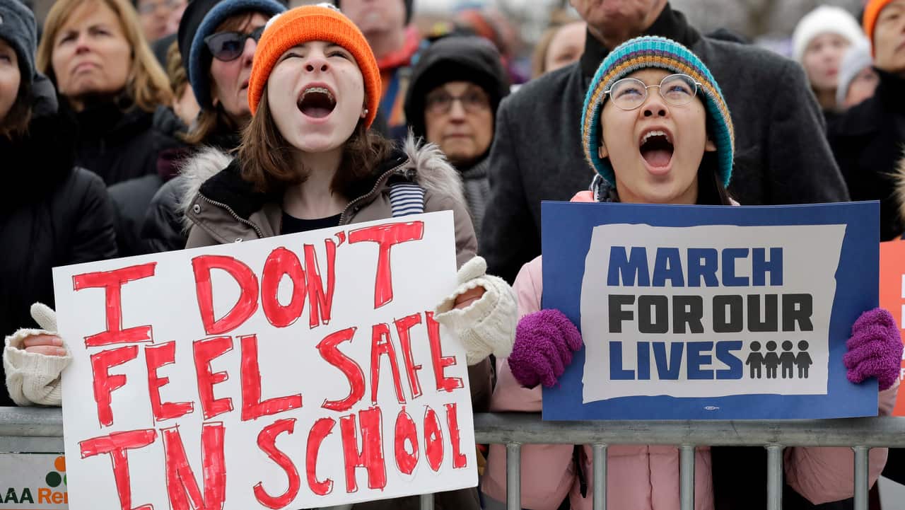 Demonstrators attend a "March for Our Lives" rally in support of gun control, 24 March 2018, in Chicago.  
