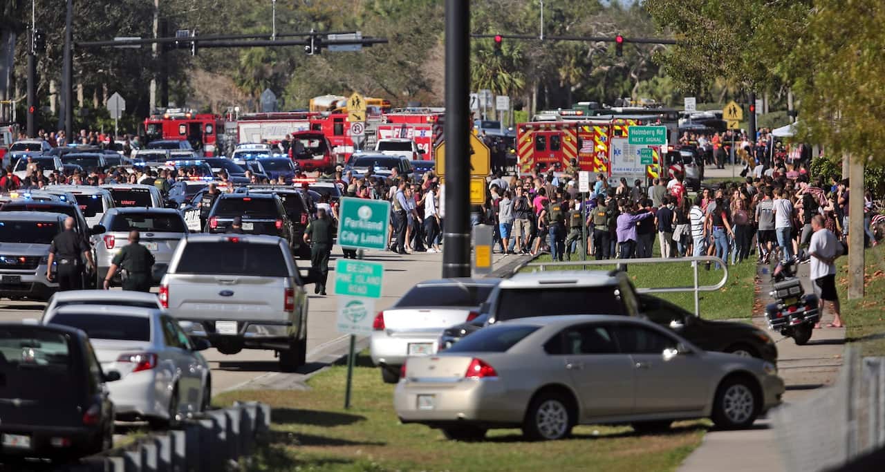 Police to try to move students out of the area after the shooting.