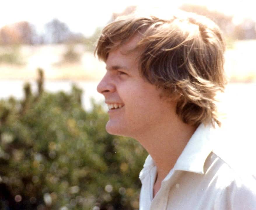 A smiling Scott Johnson in a white shirt.