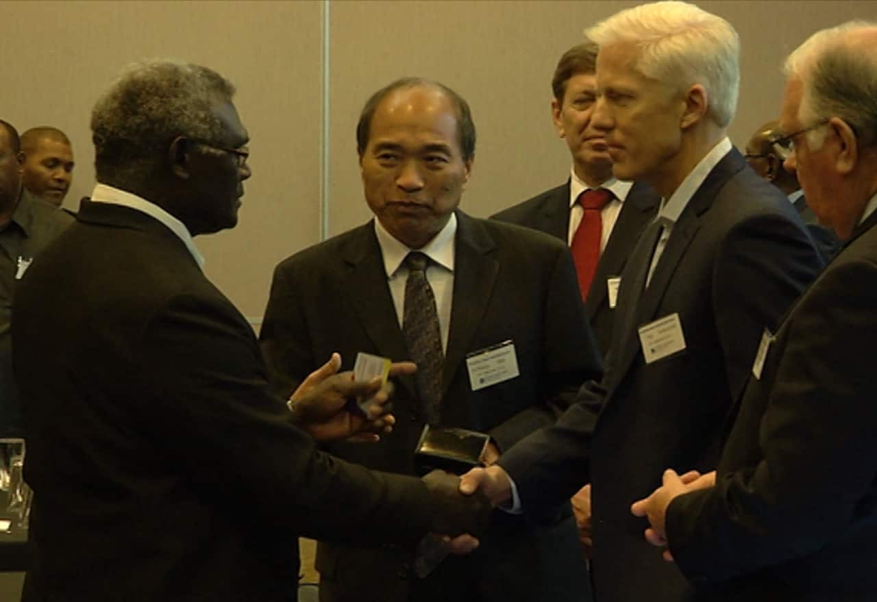 Solomon Islands prime minister Manasseh Sogavare (l) meets with AXF Resources including managing director Shaung Ren (c).