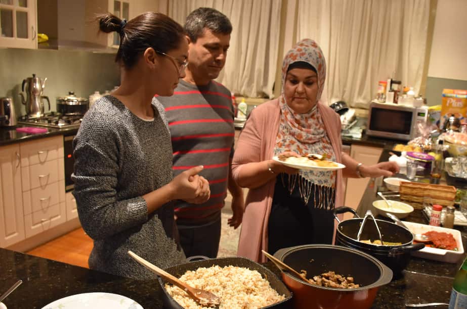 The Agar family prepare the meal.