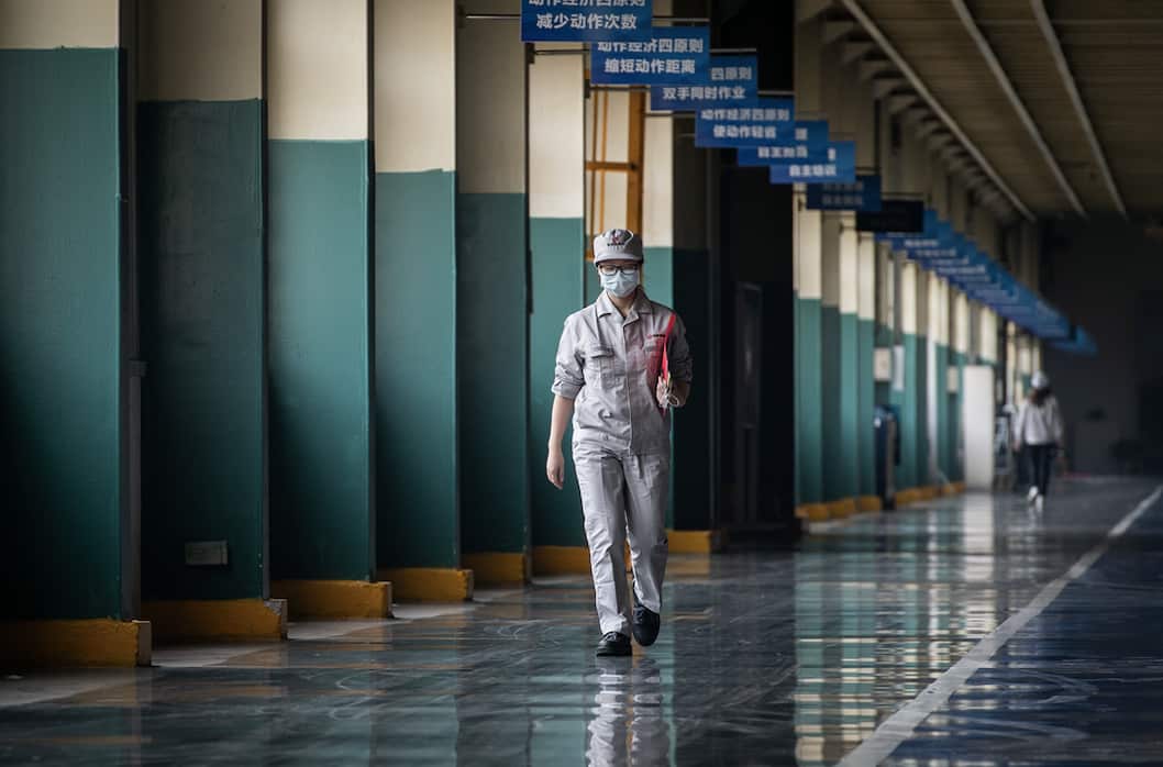 A masked worker in Wuhan this week.