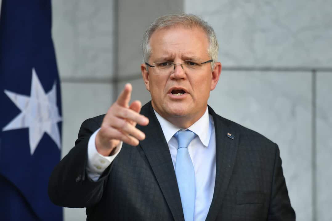 Prime Minister Scott Morrison talks to reporters. 