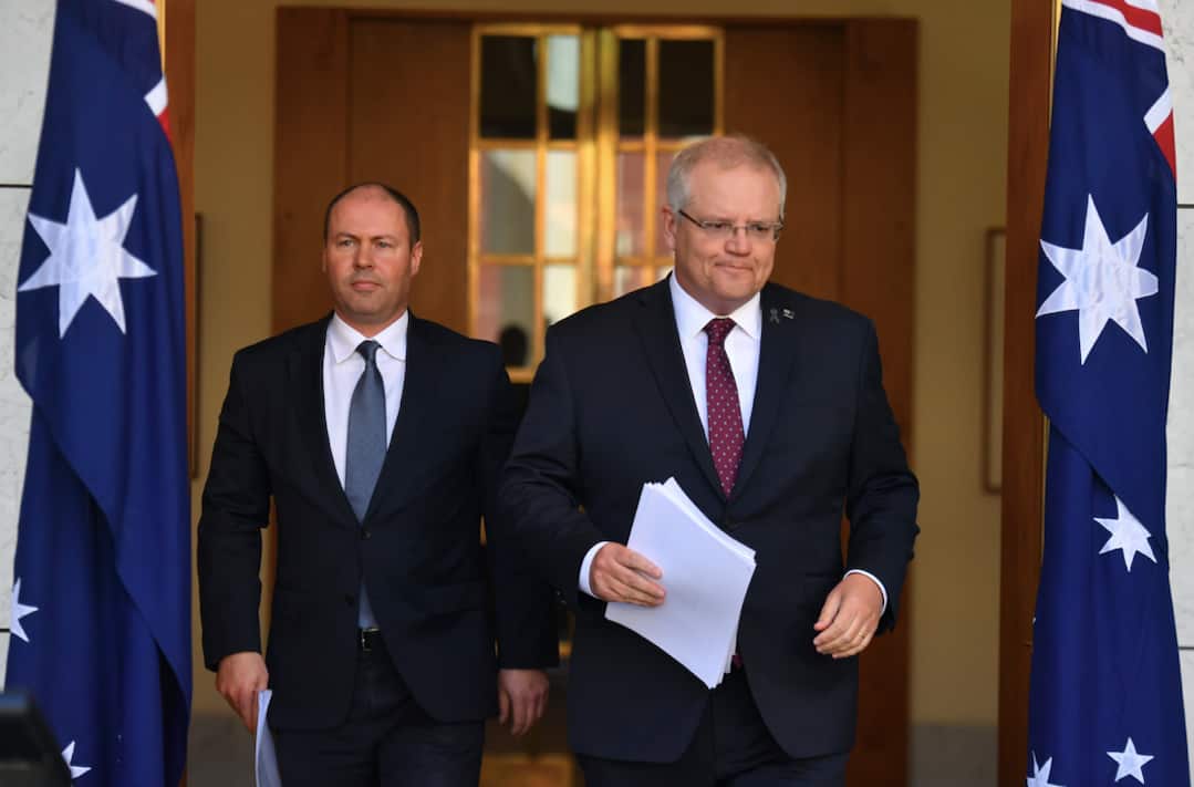 Josh Frydenberg and Scott Morrison arrive at Thursday's press conference.