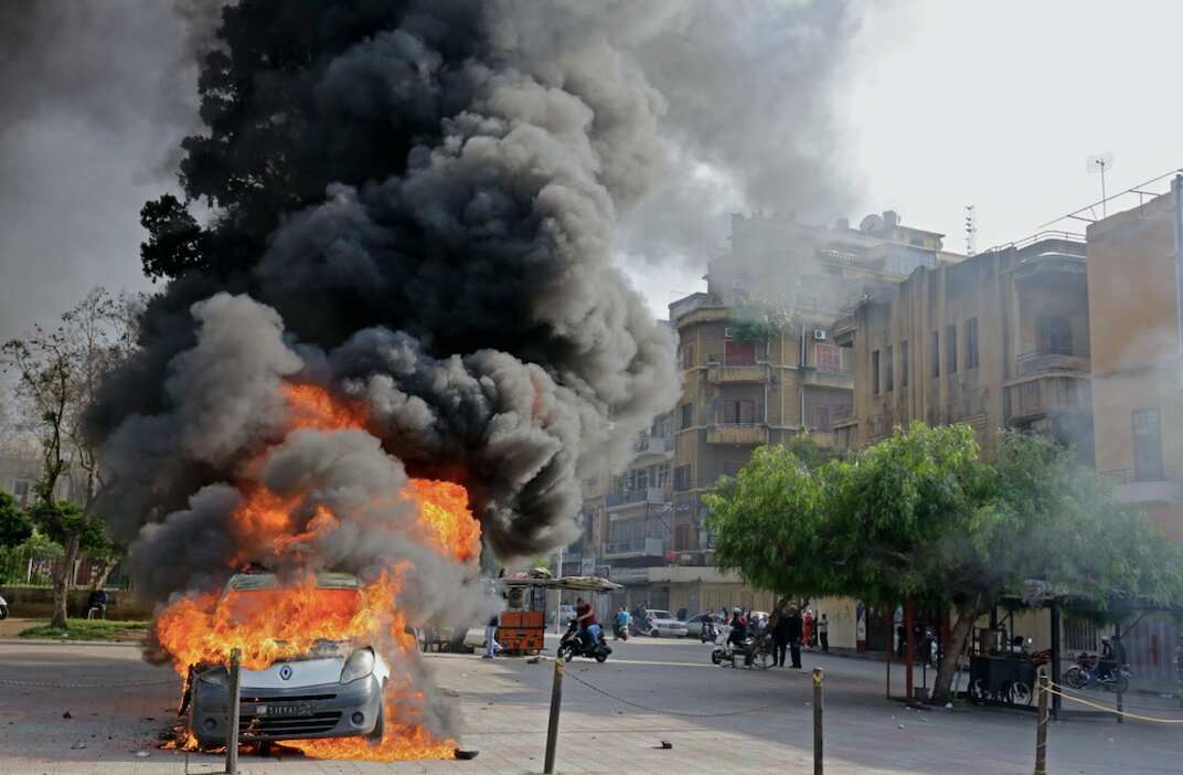 Flames engulf a car during clashes between protesters and Lebanese soldiers this week.