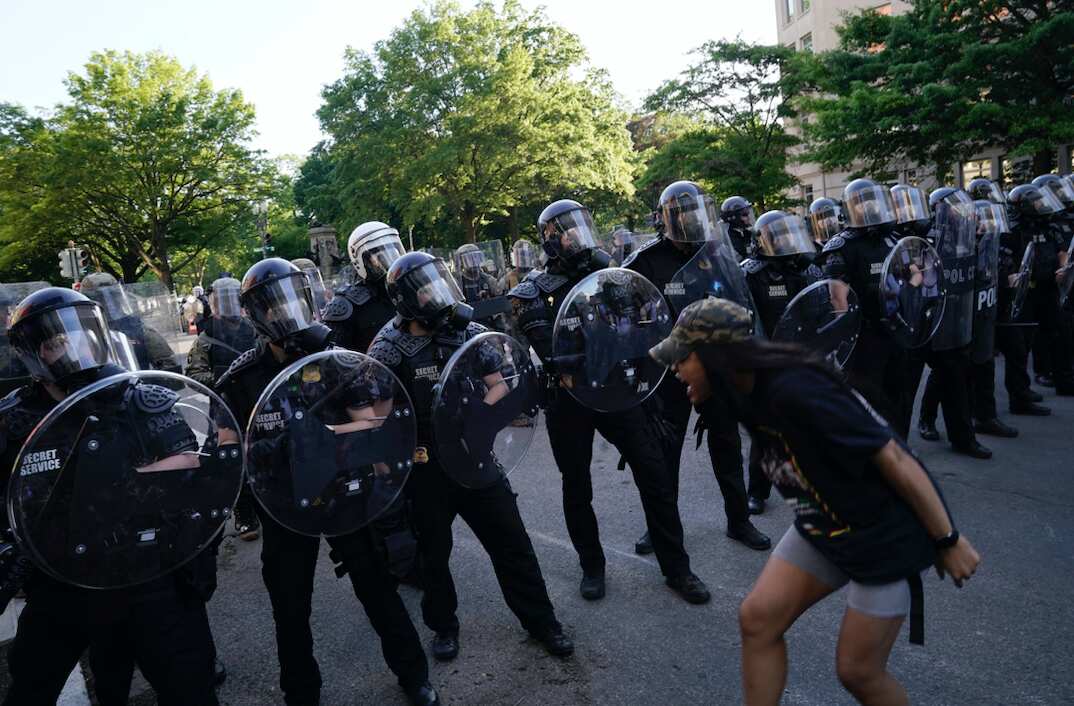 Demonstrators confront law enforcement during a protes in Washington, DC.