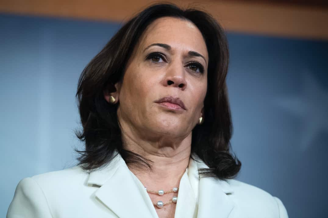 Kamala Harris talks to reporters.