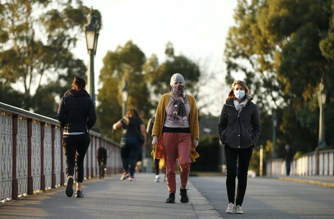 People wear masks in Melbourne.