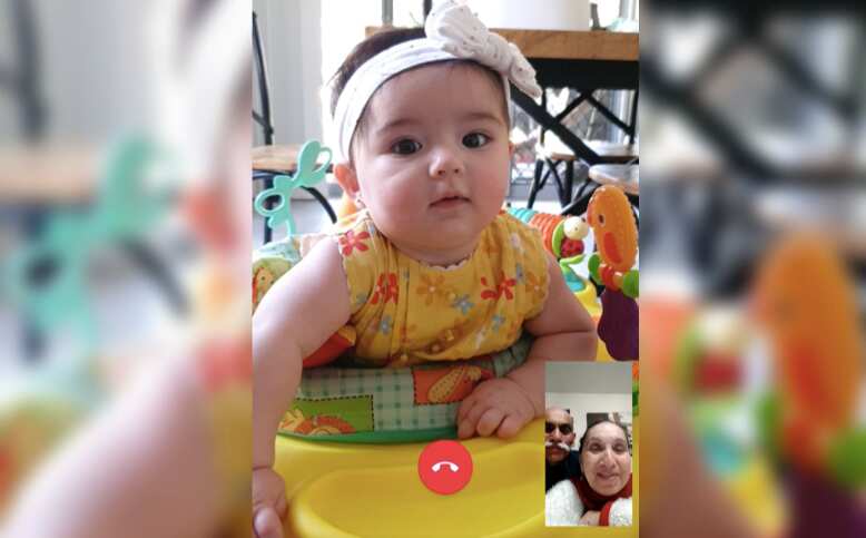 Emma and Julio Vega, bottom right, talk to their granddaughter from Peru.  