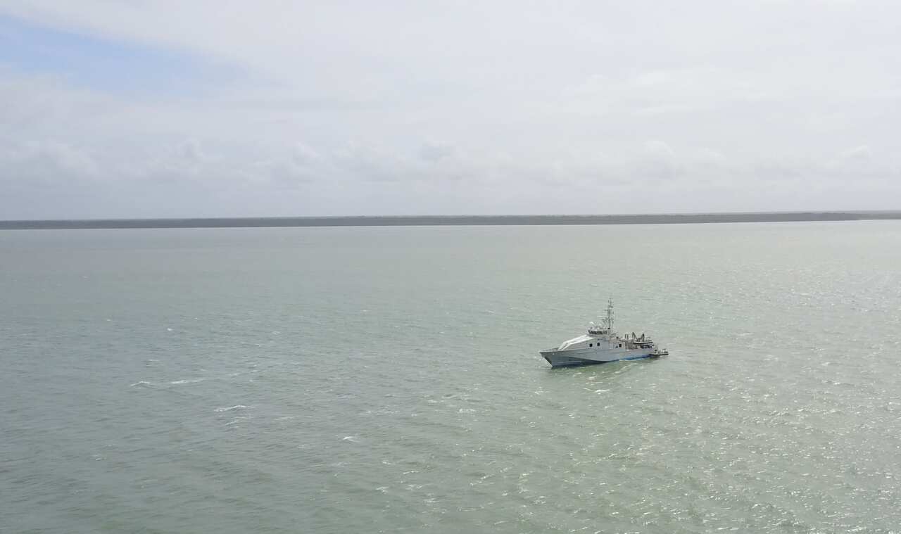 Border Force patrol boat Fortescue Bay off Saibai with the PNG South Fly coast in the background.