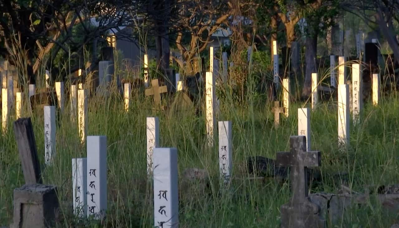 Japanese divers' graves marked by new posts funded by Japan.