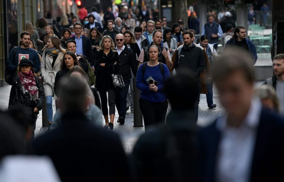 Crowds of people are seen in the central business district of Sydney