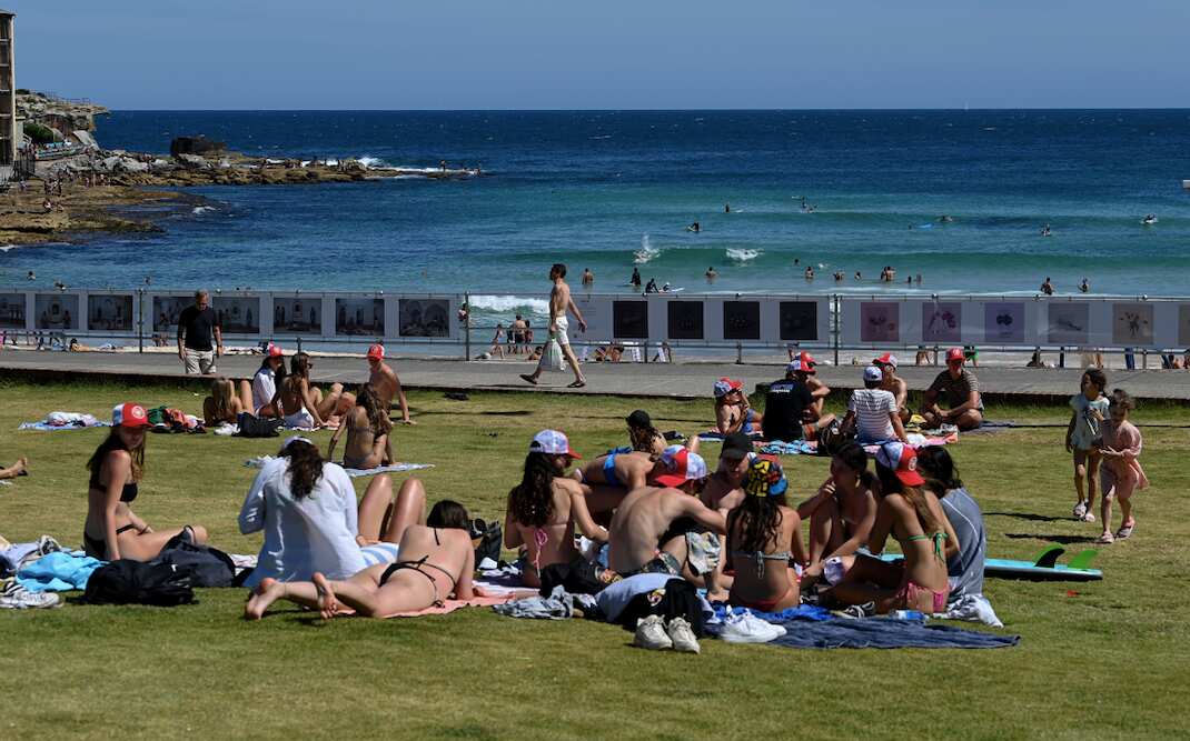 Members of the public are seen at Bondi Beach in Sydney, 15 December 2021.