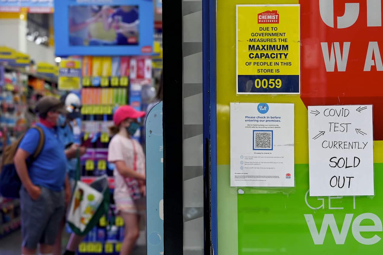 Signage notifying customers that Rapid Antigen Test (RAT) kits are sold out is seen on the entrance to a chemist in Sydney, Tuesday, 11 vJanuary, 2022. 