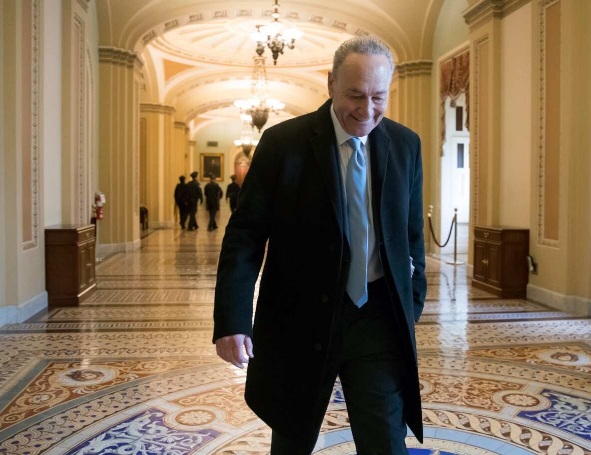 Senate Minority Leader Chuck Schumer, D-N.Y., arrives at the Capitol at the start of the third day of the government shutdown (AAP)
