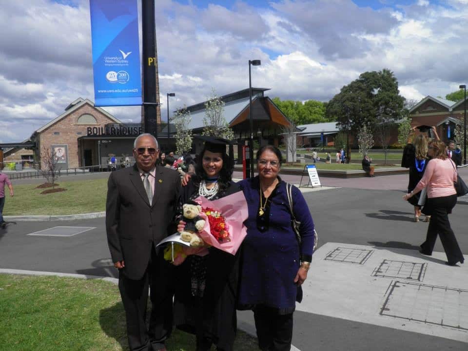 Akanksha at her graduation with her parents