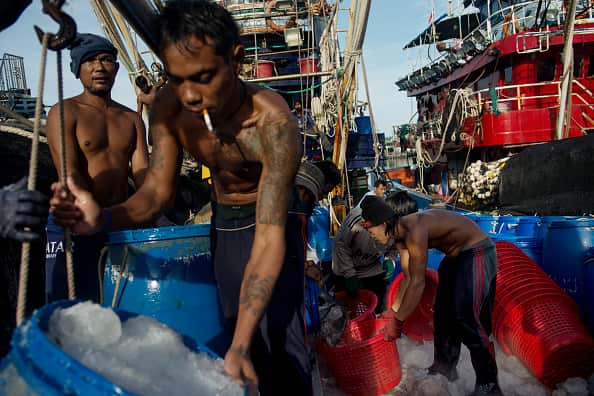 Migrant workers on a fishing boat Phuket, Thailand. Thailand's fishing industry is rife with slave labour.