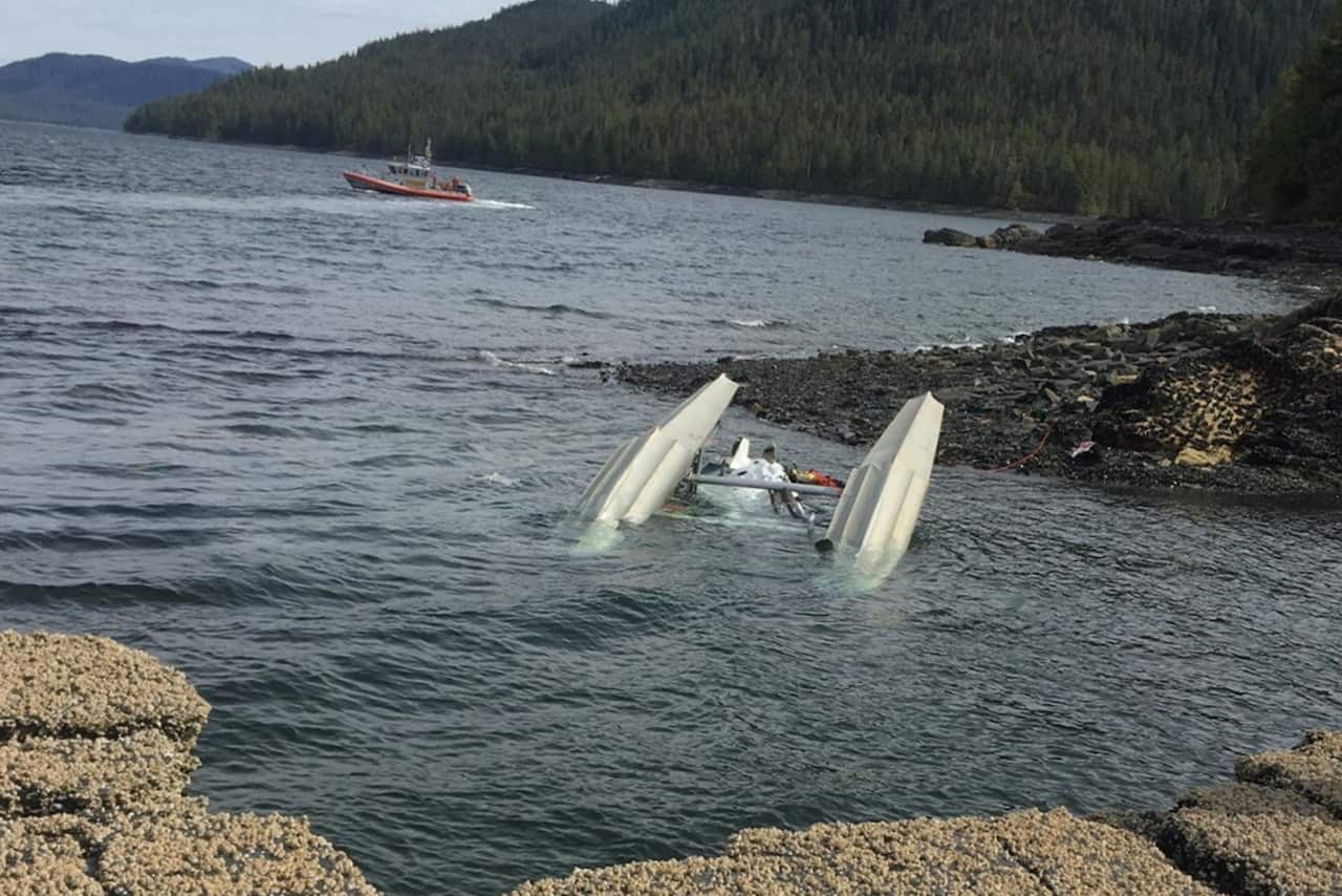 An Australian cruise ship passenger has died and 10 Americans are injured after two seaplanes collided.