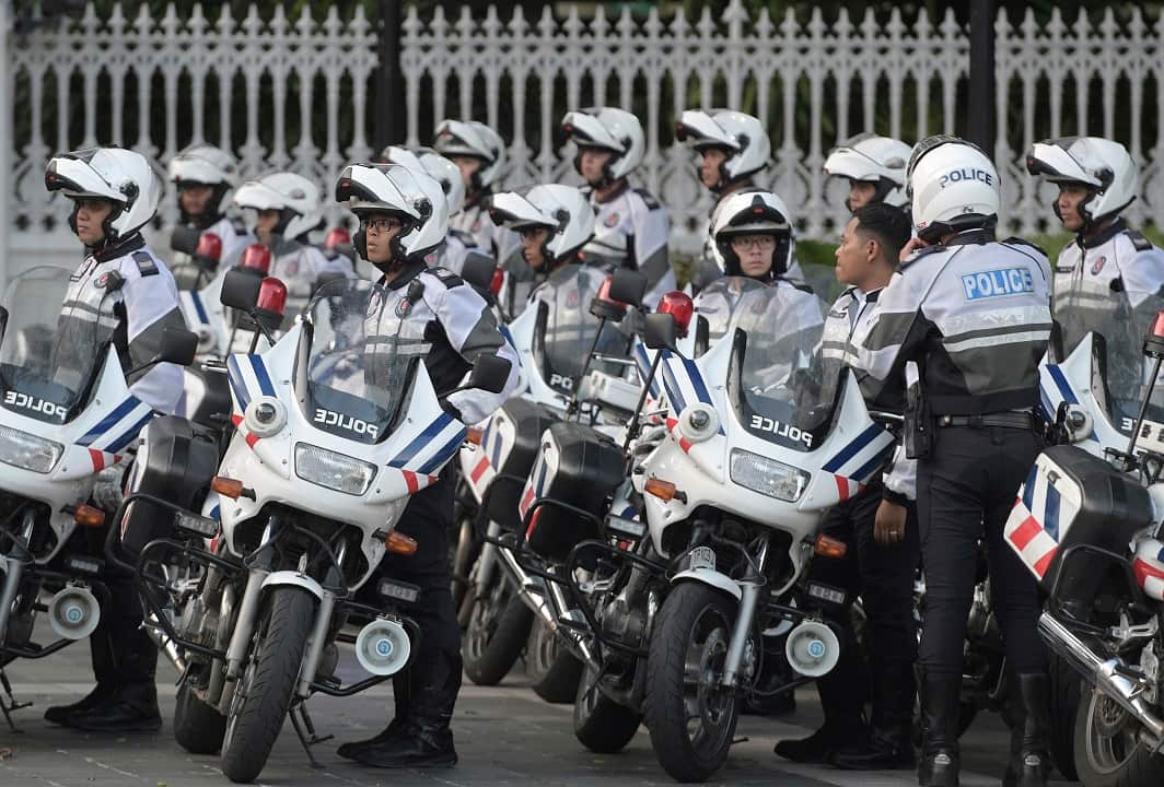 Police officers escort Kim Jong-un's motorcade.