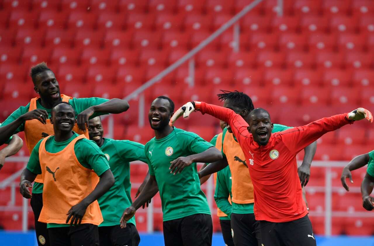 Senegal's players warm up during a training session, on June 18, 2018 in Moscow