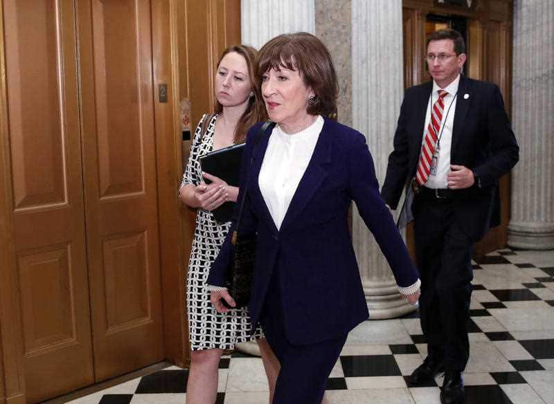 Senator Collins arrives for the crucial vote.