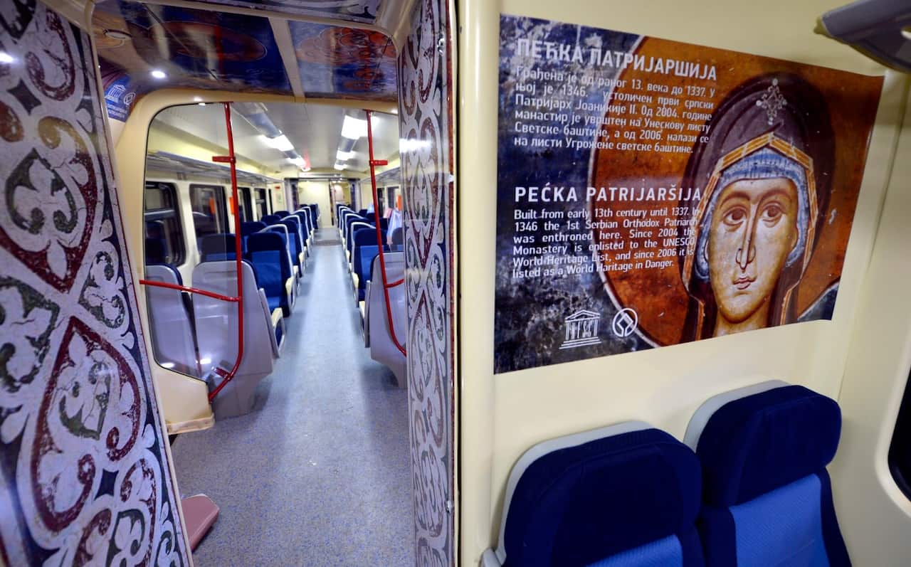 Interior view of a train that has been decorated with large images of Serbian Orthodox religious icons from famous monasteries in Kosovo (AAP)