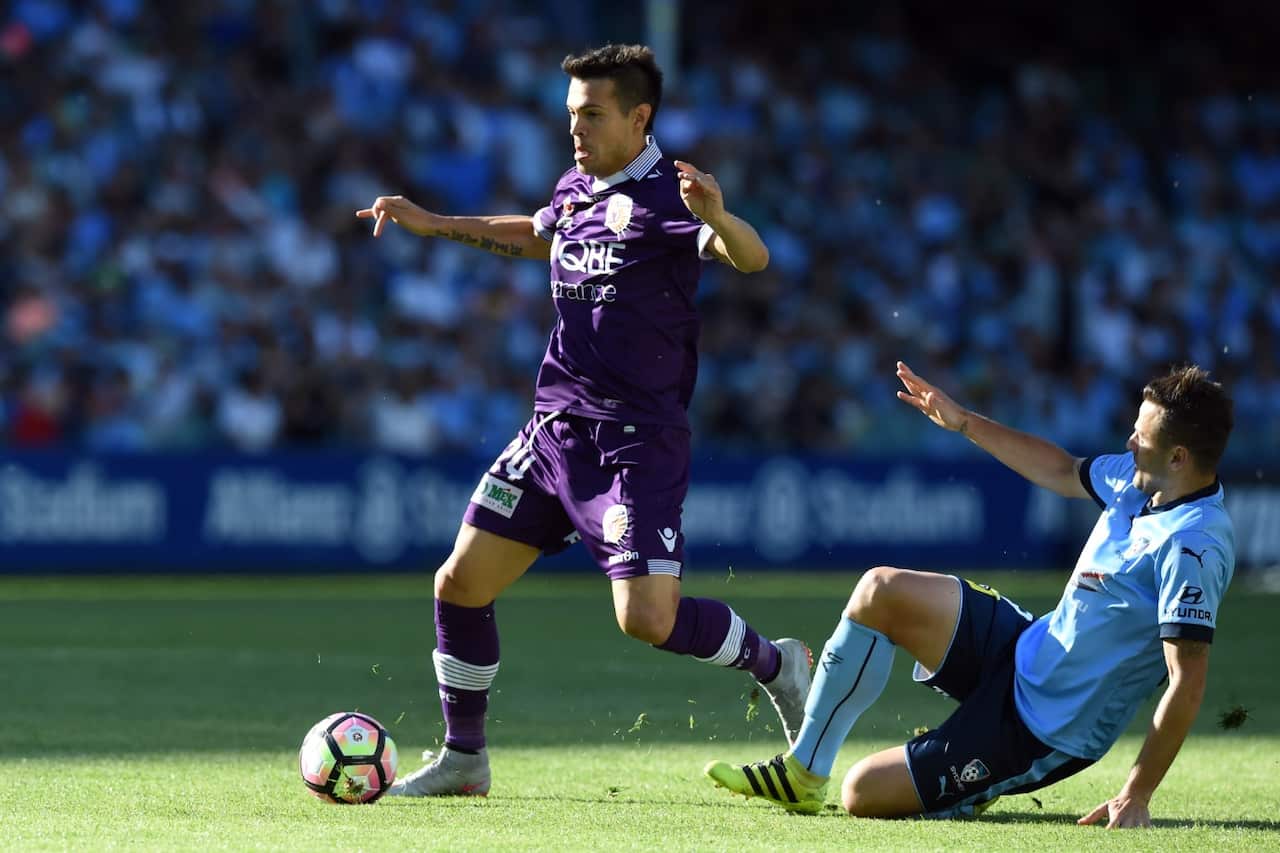 Milan Smiljanic (left) of the Glory competes for the ball against Sydney FC in November