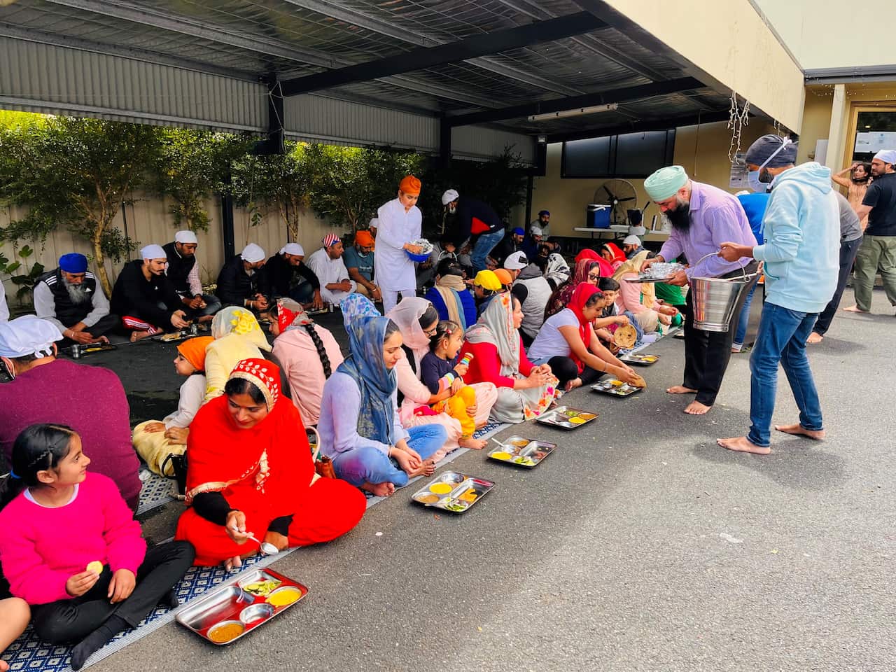 Members of the Sikh community serving Langar at the Albury Gurdwara
