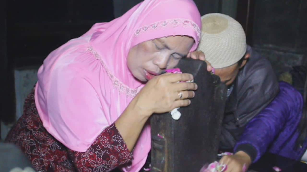 Mardiyah prays at sex mountain, in the hope that the ritual will help provide money to pay her debts.