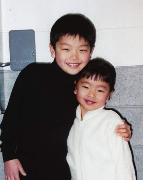 Maia Shibutani and Alex Shibutani, at a young age, pose for the camera.