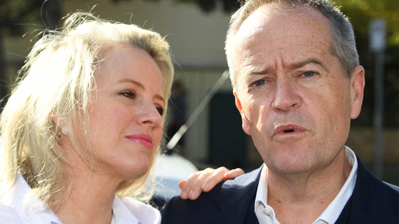 Bill Shorten (right) speaks to media aside wife Chloe outside their property in Moonee Ponds, following his defeat. .