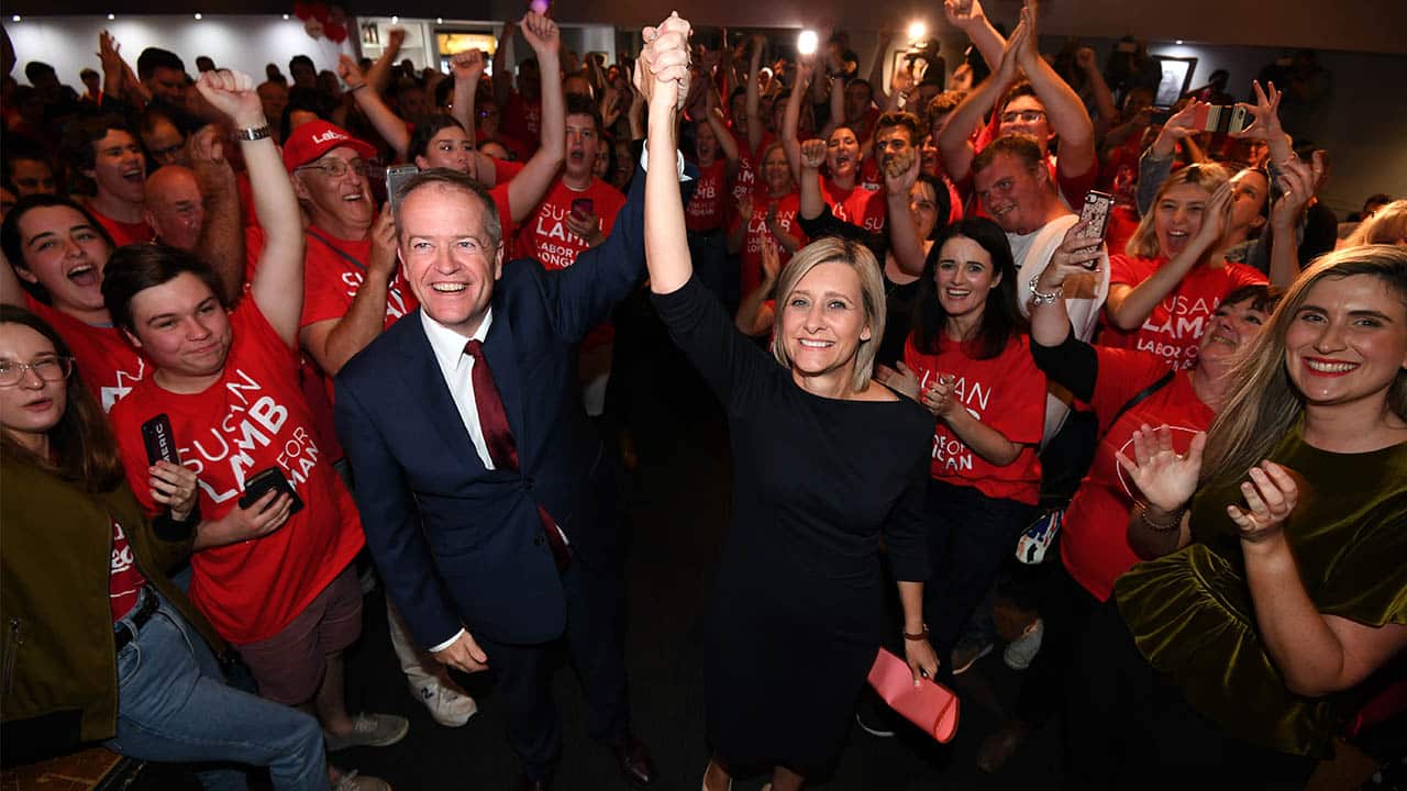 Opposition leader Bill Shorten celebrates with Susan Lamb.
